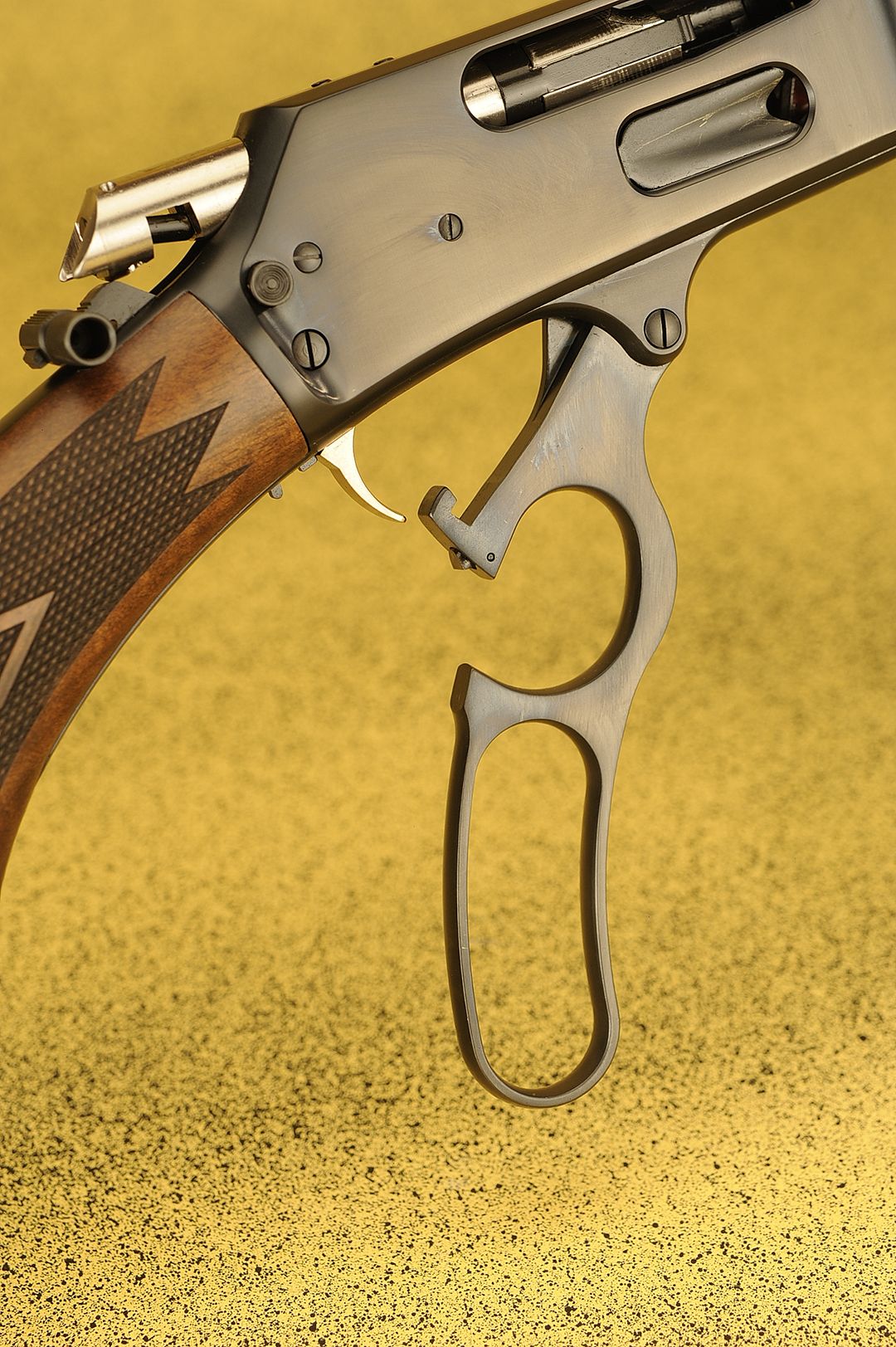 Forged from alloy steel, the lever is polished and blued to match the gun. The trigger is gold plated.
